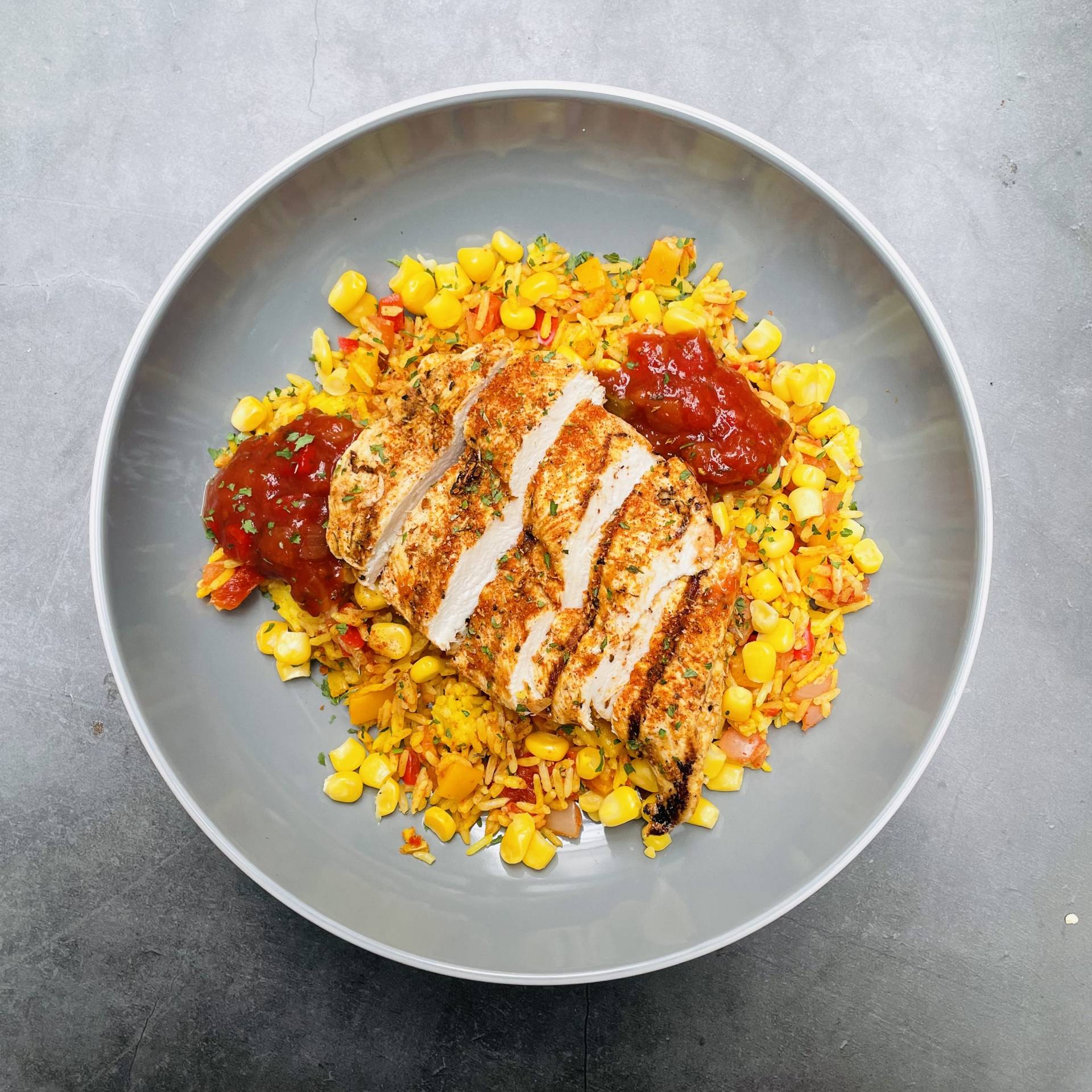 CAJUN CHICKEN, DIRTY RICE, SWEETCORN AND SALSA