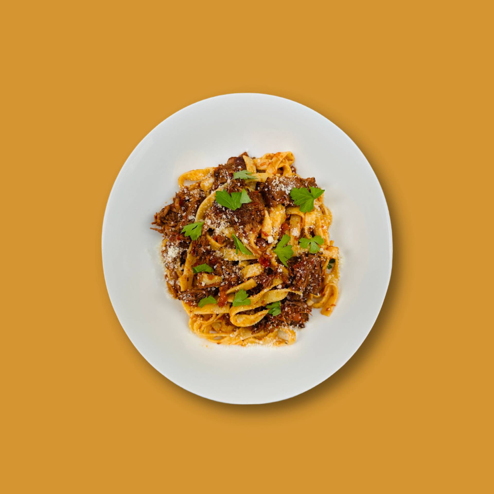BRAISED BEEF RAGU, PENNE PASTA, PARMESAN